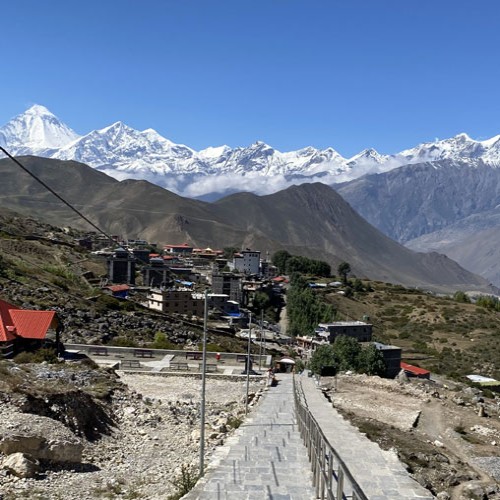 Annapurna Circuit Trek panoramic mountain view with trekkers in Nepal
