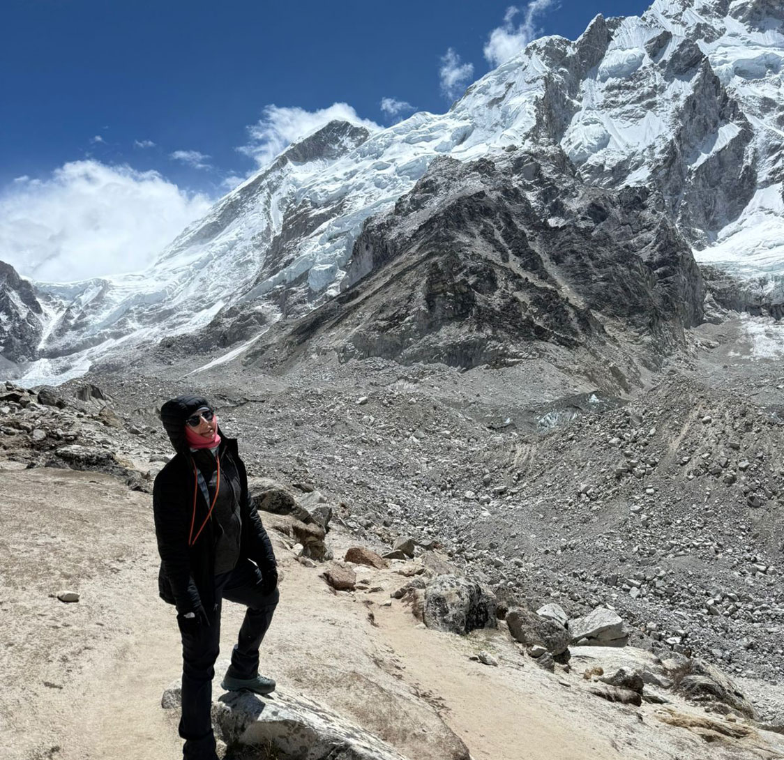 Female trekkers on the Everest Base Camp trail during clear weather