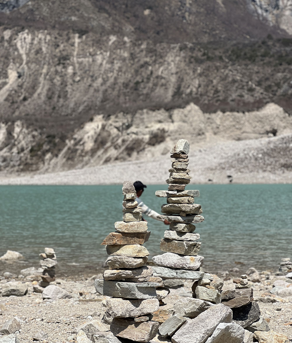 Birendra Lake near Samagaun on the Manaslu Circuit Trek with Mount Manaslu reflected in the water