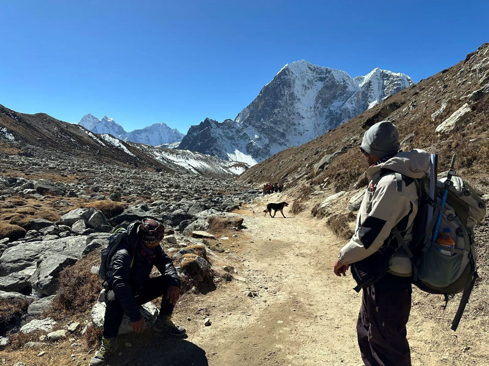 Trekkers and guide trekking to Everest Base Camp during monsoon season