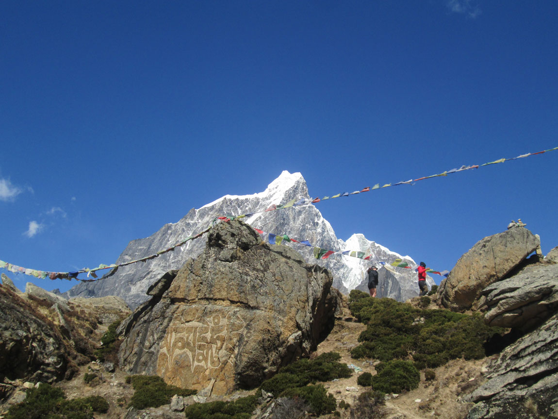 Trekkers climbing through the mountains on the Everest Base Camp trail