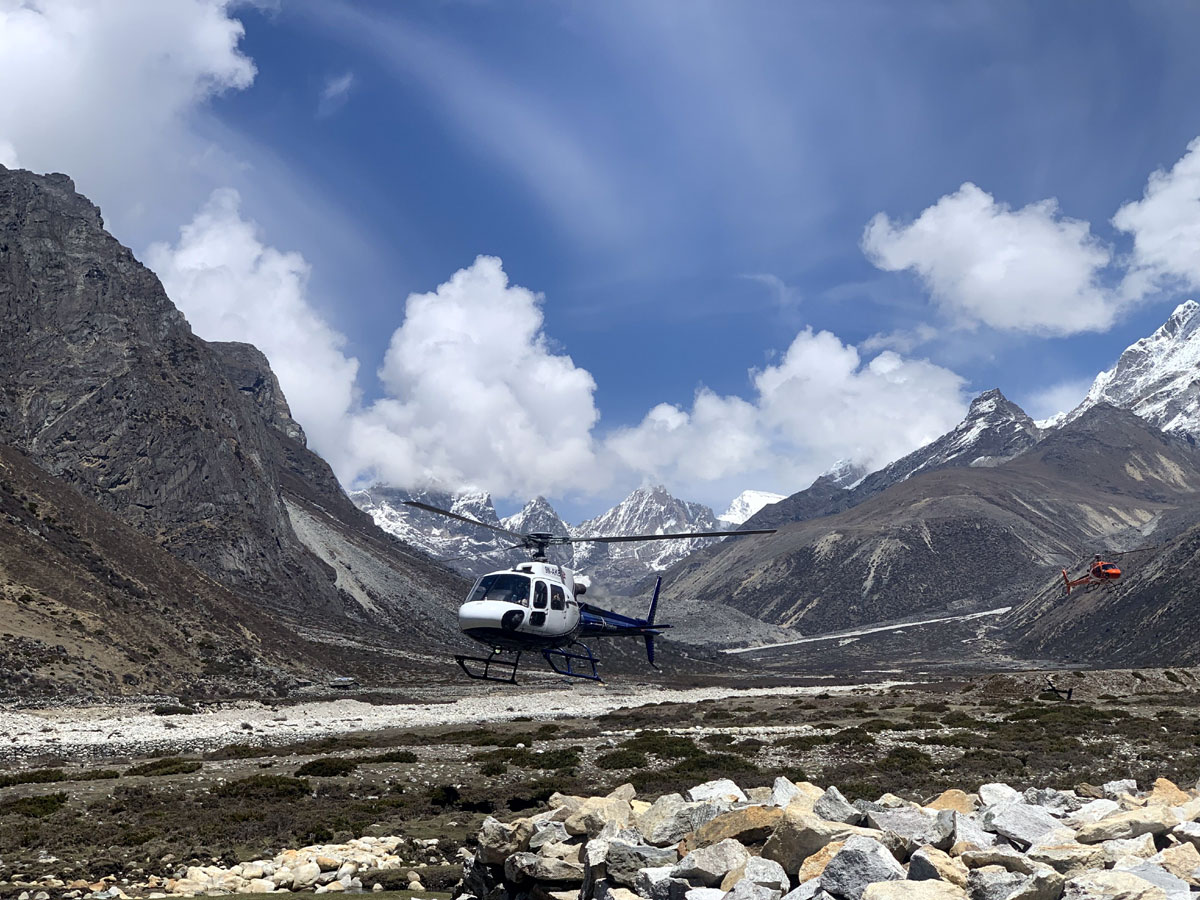 Everest helicopter near Kala Patthar with Mount Everest in the background