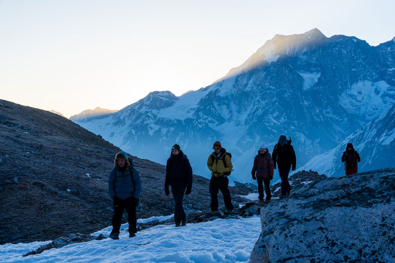 Indian trekkers walking on the Manaslu Circuit Trek trail in Nepal