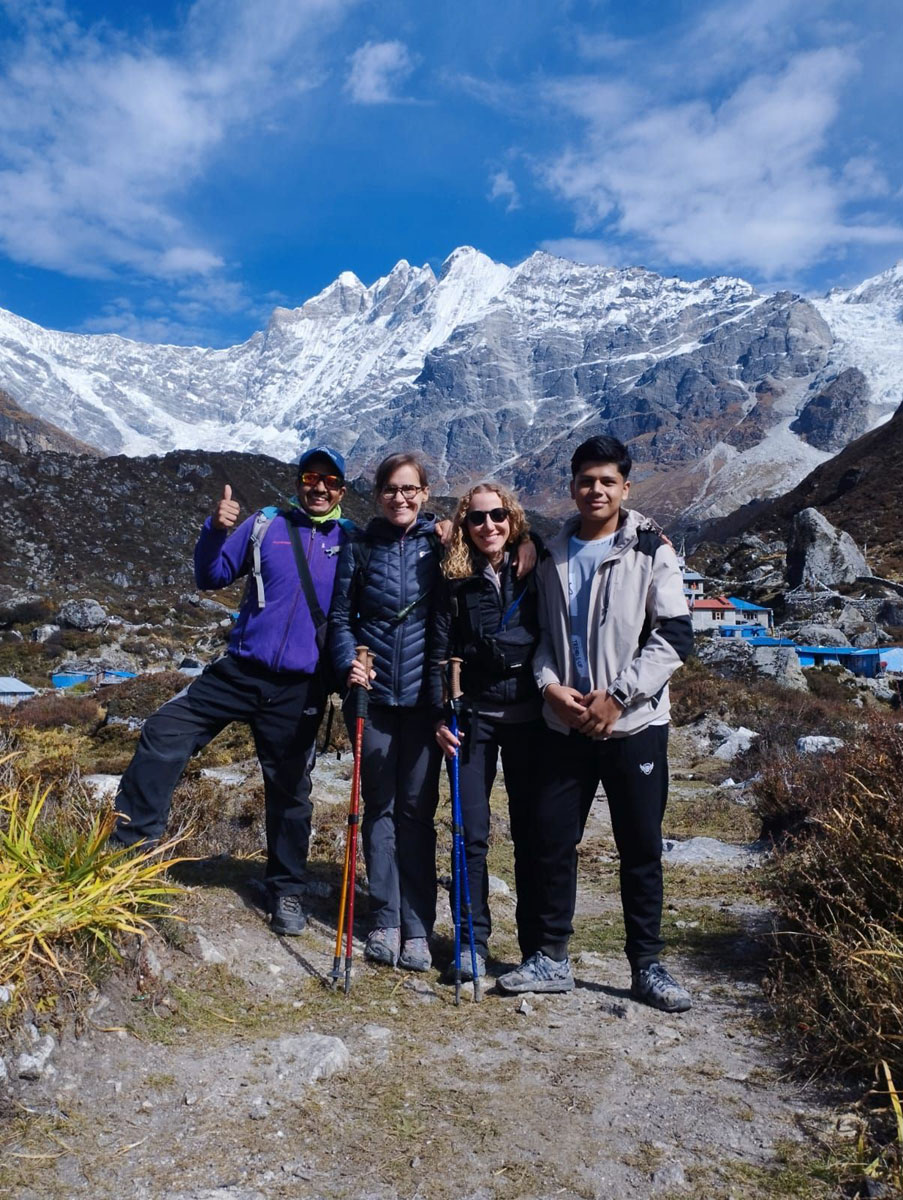 Trekkers enjoying mountain views at Kyanjin Gompa in Langtang Valley