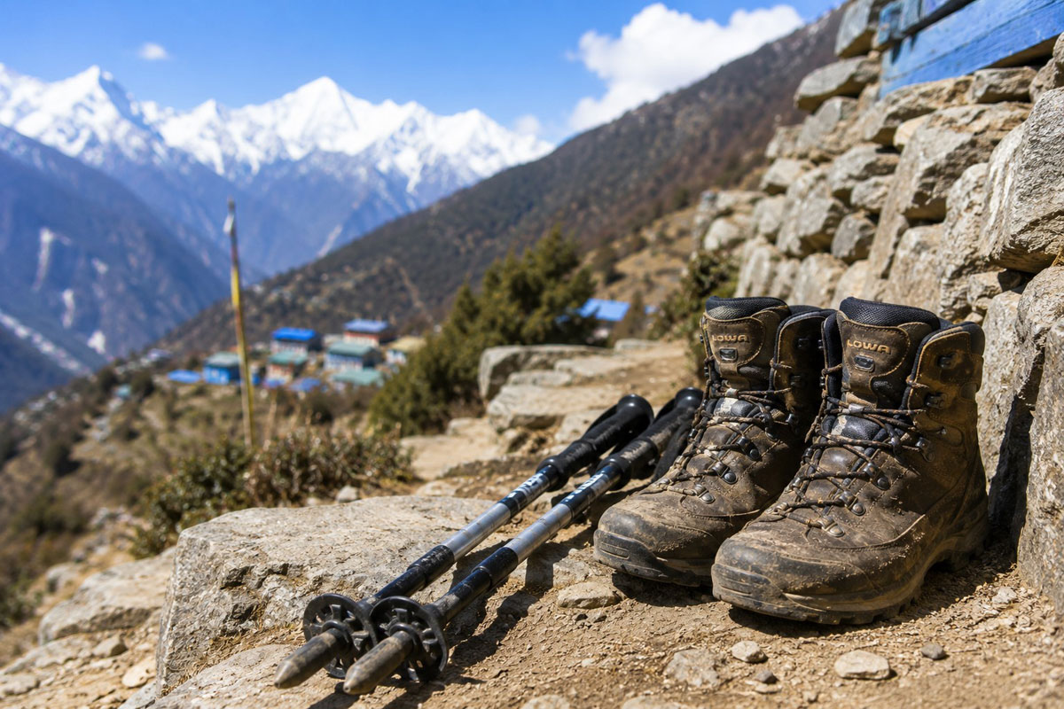 Waterproof trekking boots and trekking poles on the Langtang Valley Trek trail in Nepal