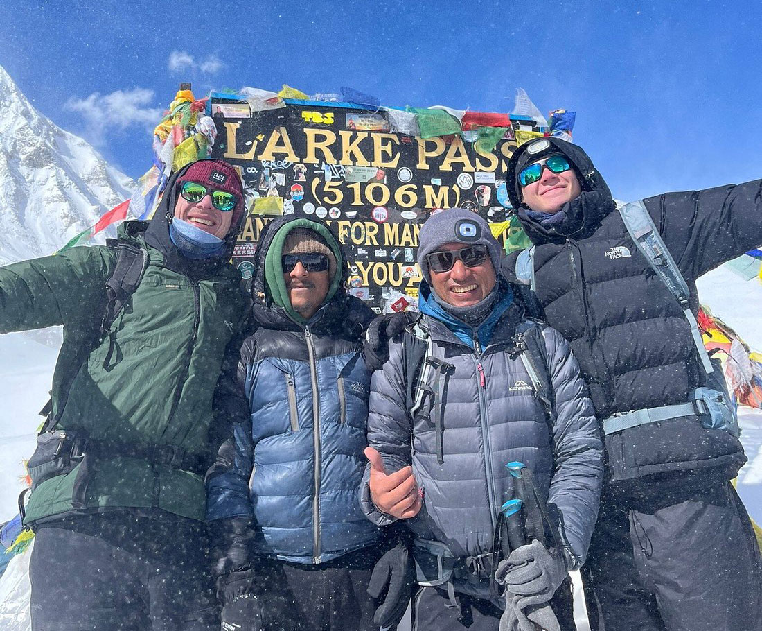 Trekkers crossing Larkya La Pass on the Manaslu Circuit