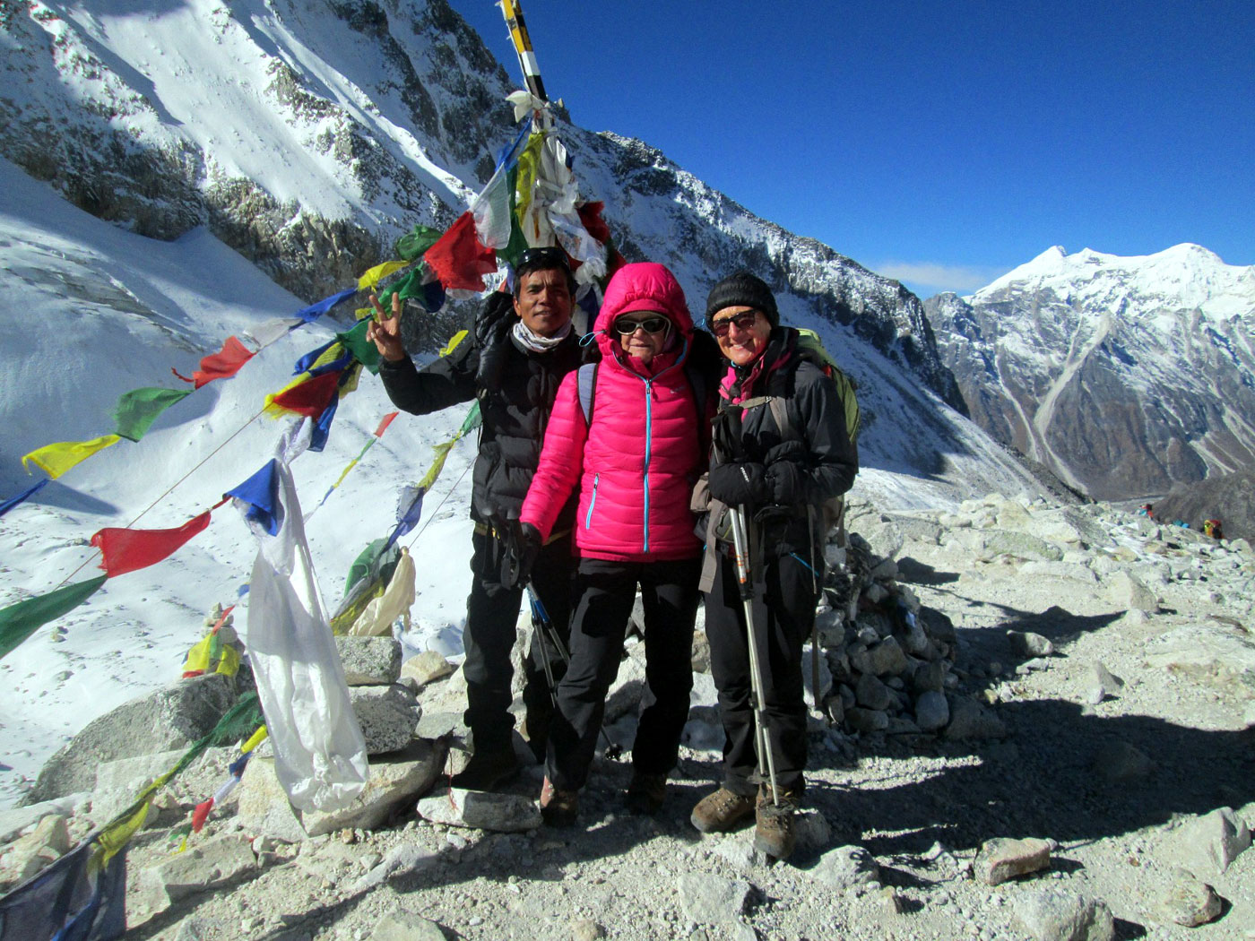 Senior trekkers crossing Larkya La Pass on Manaslu Circuit Trek