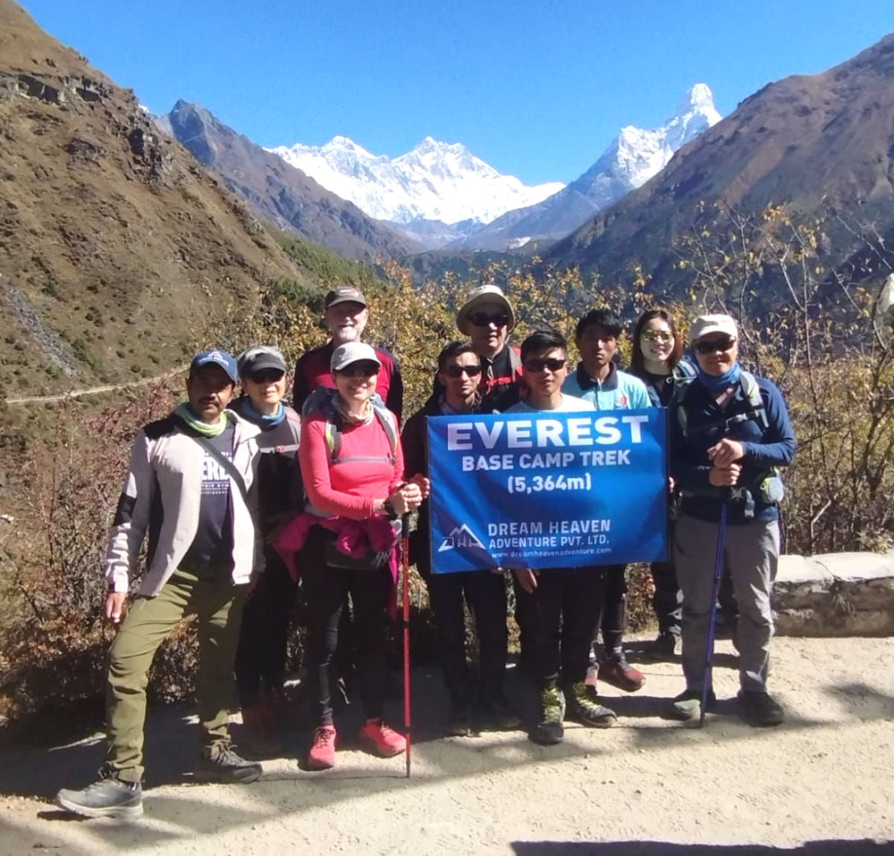 First-time trekkers walking the Everest Base Camp Trek trail between Lukla and Phakding