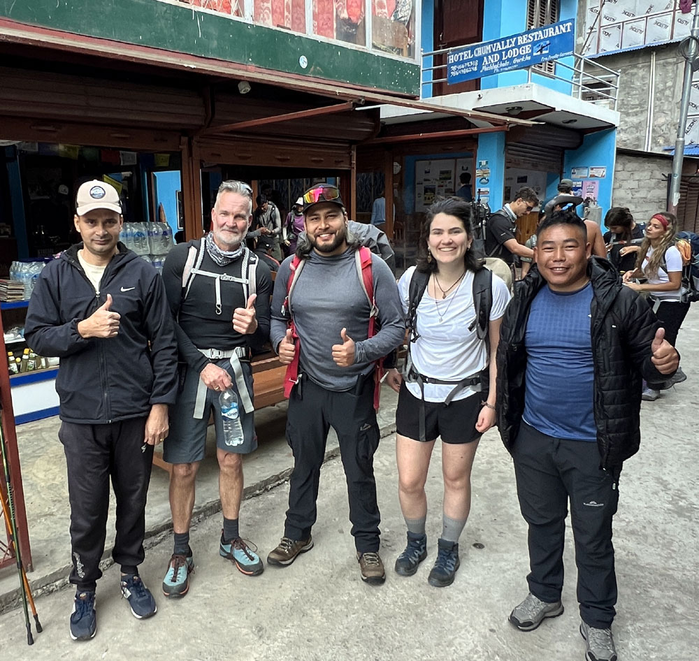 Trekkers passing Machha Khola on the Manaslu Circuit Trek