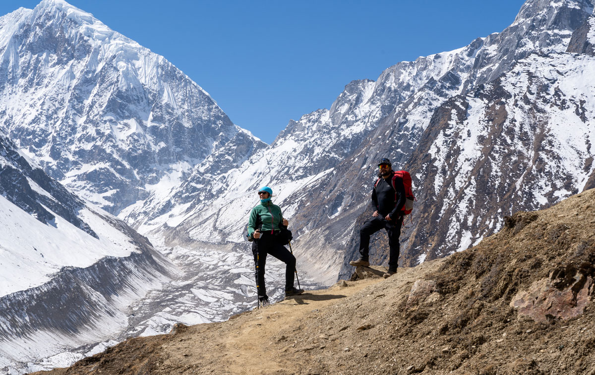 Licensed trekking guide leading a small group on the Manaslu Circuit Trek in Nepal