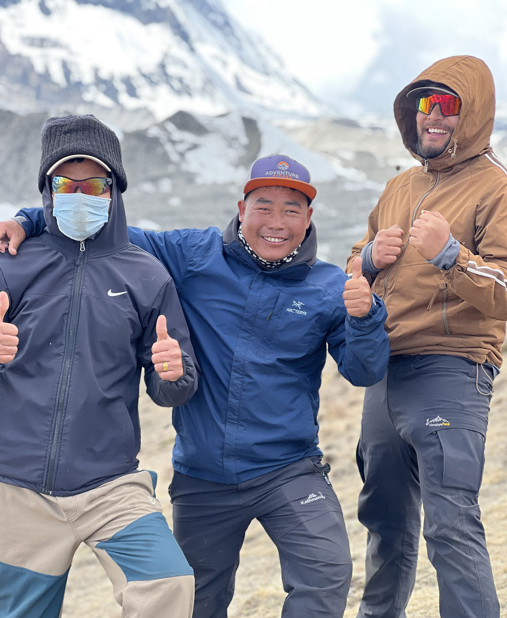 Manaslu trekking guide and porter supporting trekkers in Manaslu Nepal