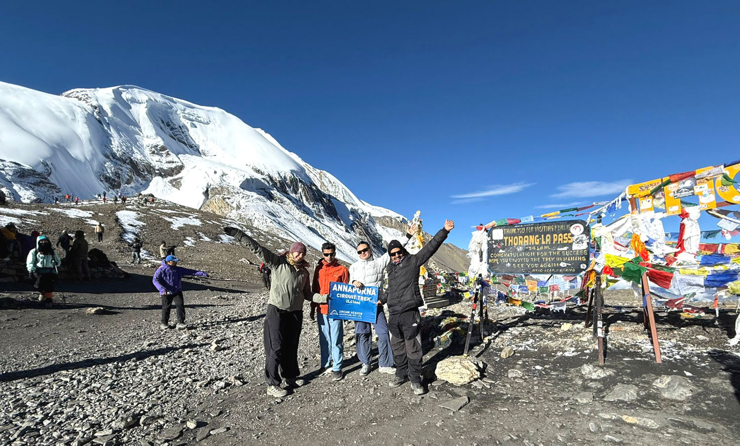 Trekkers crossing Thorong La Pass 5416m on the Annapurna Circuit Trek Nepal