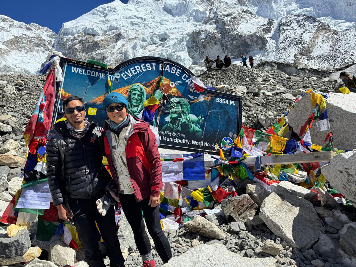 Trekkers celebrating at Everest Base Camp in Nepal