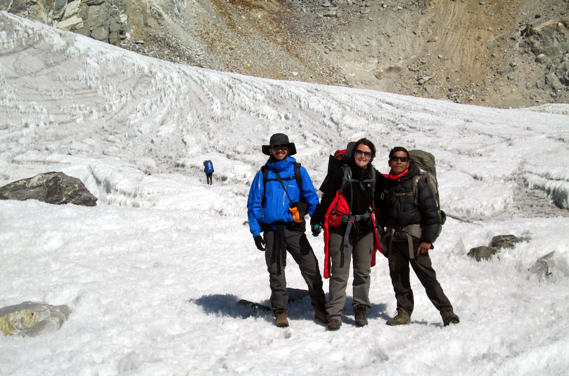 Trekkers and porter walking on the Everest Base Camp trail