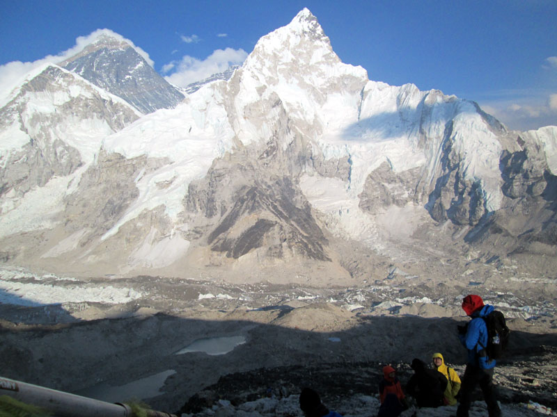 Trekkers enjoying the panoramic Everest mountain view from Kala Patthar during a winter Everest Base Camp Trek